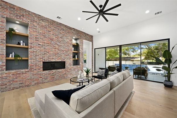 Fireplace, Interior, Living room, Recessed Lighting, Stone Walls, Wood Texture Flooring