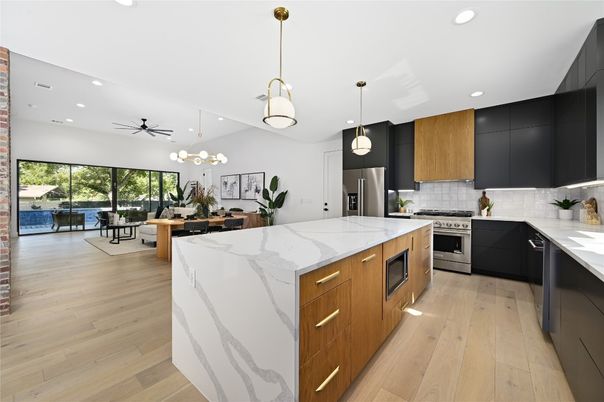 Dining room, Interior, Kitchen, Pendant Lights, Recessed Lighting, Stainless Steel Appliances, Wood Texture Flooring
