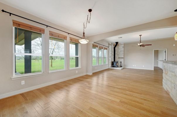 Empty room, Fireplace, Interior, Pendant Lights, Stone Walls, Wood Texture Flooring