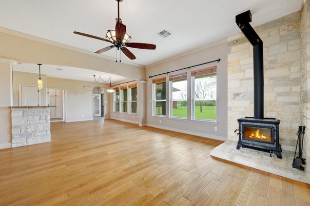 Empty room, Fireplace, Interior, Pendant Lights, Stone Walls, Wood Texture Flooring