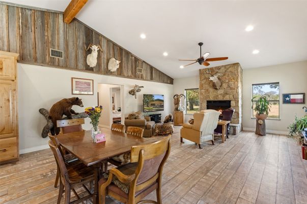 Dining room, Fireplace, Interior, Living room, Recessed Lighting, Stone Walls, Wooden Beams, Wood Texture Flooring