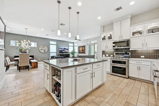 Dining room, Interior, Kitchen, Pendant Lights, Recessed Lighting, Stainless Steel Appliances, Wood Texture Flooring