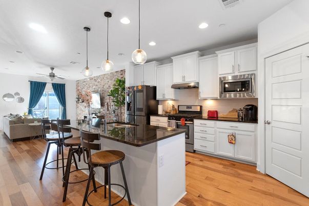 Dining room, Interior, Kitchen, Pendant Lights, Recessed Lighting, Stainless Steel Appliances, Wood Texture Flooring