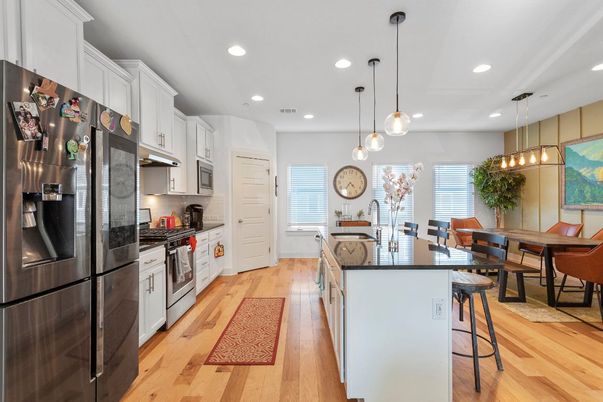 Dining room, Interior, Kitchen, Pendant Lights, Recessed Lighting, Stainless Steel Appliances, Wood Texture Flooring