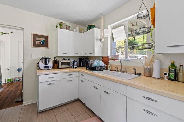 Interior, Kitchen, Pendant Lights, Tile Countertops, Wood Texture Flooring