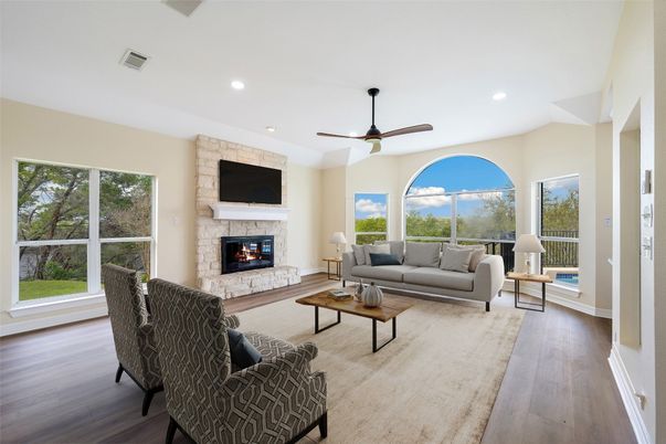 Fireplace, Interior, Living room, Recessed Lighting, Stone Walls, Wood Texture Flooring