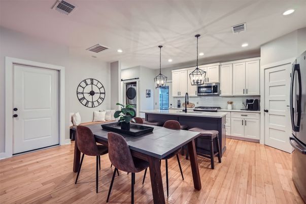 Dining room, Interior, Kitchen, Pendant Lights, Recessed Lighting, Stainless Steel Appliances, Wood Texture Flooring
