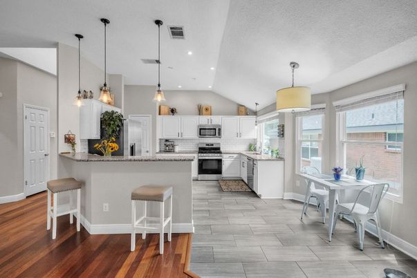 Dining room, Interior, Kitchen, Pendant Lights, Recessed Lighting, Stainless Steel Appliances, Wood Texture Flooring