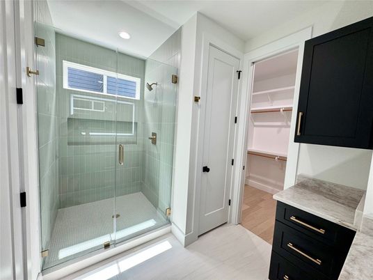 Bathroom, Glass Shower, Interior, Recessed Lighting, Walk-in Closets, Wood Texture Flooring