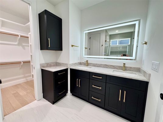 Bathroom, Dual Sink Vanities, Interior, Recessed Lighting, Walk-in Closets, Wood Texture Flooring