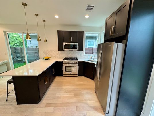 Interior, Kitchen, Pendant Lights, Recessed Lighting, Stainless Steel Appliances, Wood Texture Flooring