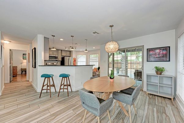 Dining room, Interior, Kitchen, Pendant Lights, Recessed Lighting, Stainless Steel Appliances, Wood Texture Flooring
