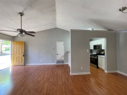 Empty room, Interior, Kitchen, Stainless Steel Appliances, Wood Texture Flooring