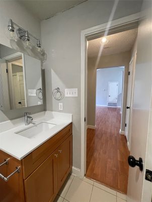 Bathroom, Dual Sink Vanities, Interior, Recessed Lighting, Wood Texture Flooring