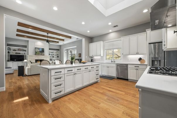 Fireplace, Interior, Kitchen, Living room, Pendant Lights, Recessed Lighting, Stainless Steel Appliances, Stone Walls, Wooden Beams, Wood Texture Flooring