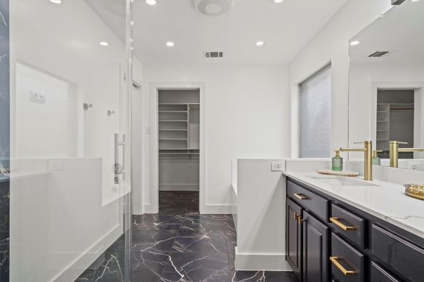 Bathroom, Dual Sink Vanities, Interior, Marble, Recessed Lighting, Walk-in Closets