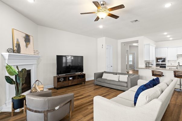 Fireplace, Interior, Kitchen, Living room, Recessed Lighting, Stainless Steel Appliances, Wood Texture Flooring
