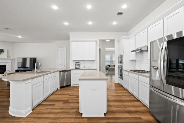Fireplace, Interior, Kitchen, Recessed Lighting, Stainless Steel Appliances, Wood Texture Flooring