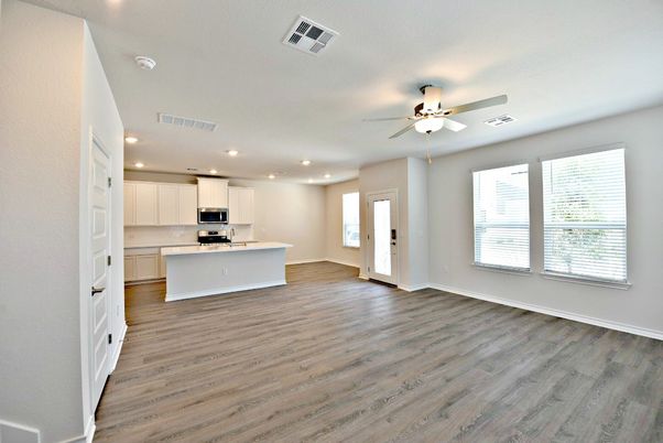 Empty room, Interior, Kitchen, Recessed Lighting, Stainless Steel Appliances, Wood Texture Flooring