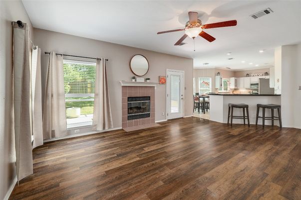 Empty room, Fireplace, Interior, Kitchen, Recessed Lighting, Wood Texture Flooring