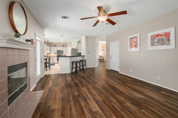 Empty room, Fireplace, Interior, Kitchen, Recessed Lighting, Wood Texture Flooring