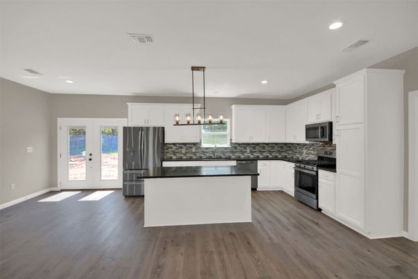 Interior, Kitchen, Pendant Lights, Recessed Lighting, Stainless Steel Appliances, Wood Texture Flooring