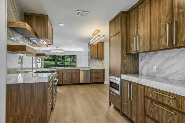 Interior, Kitchen, Marble Walls, Recessed Lighting, Stainless Steel Appliances, Wood Texture Flooring