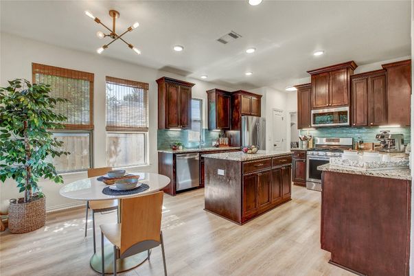 Dining room, Interior, Kitchen, Pendant Lights, Recessed Lighting, Stainless Steel Appliances, Wood Texture Flooring