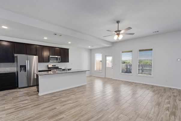 Empty room, Interior, Kitchen, Recessed Lighting, Stainless Steel Appliances, Wood Texture Flooring