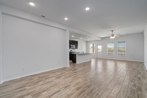 Empty room, Interior, Kitchen, Recessed Lighting, Stainless Steel Appliances, Wood Texture Flooring