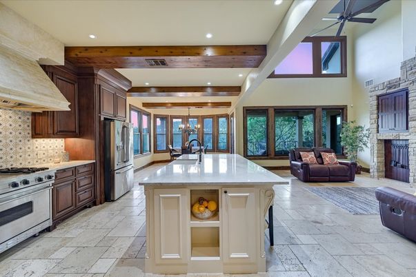 Chandelier, Fireplace, Interior, Kitchen, Living room, Recessed Lighting, Stainless Steel Appliances, Wooden Beams