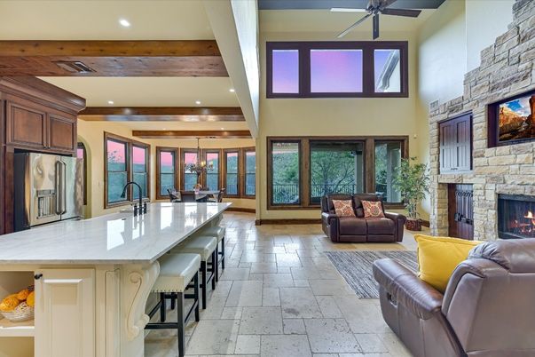 Chandelier, Dining room, Fireplace, Interior, Kitchen, Living room, Pendant Lights, Recessed Lighting, Stone Walls, Wooden Beams