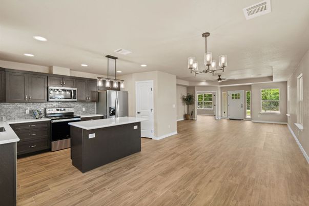 Chandelier, Interior, Kitchen, Pendant Lights, Recessed Lighting, Stainless Steel Appliances, Wood Texture Flooring