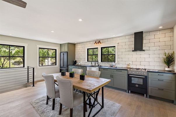 Dining room, Interior, Kitchen, Recessed Lighting, Stainless Steel Appliances, Stone Walls, Wood Texture Flooring