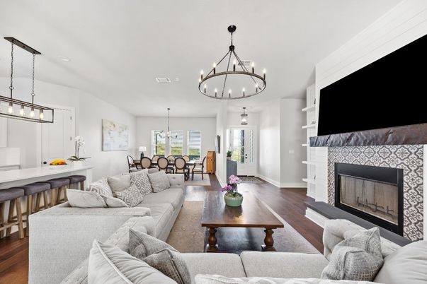 Chandelier, Dining room, Fireplace, Interior, Living room, Pendant Lights, Recessed Lighting, Wood Texture Flooring