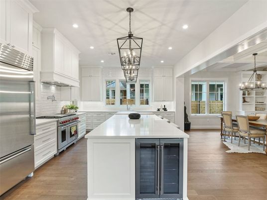Chandelier, Dining room, Interior, Kitchen, Pendant Lights, Recessed Lighting, Stainless Steel Appliances, Wood Texture Flooring