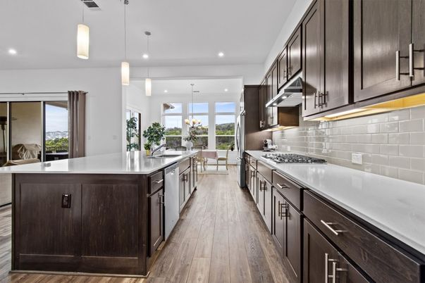 Chandelier, Dining room, Interior, Kitchen, Pendant Lights, Recessed Lighting, Stainless Steel Appliances, Wood Texture Flooring