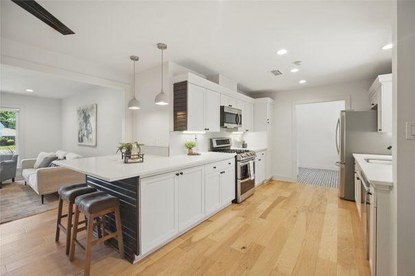 Dining room, Interior, Kitchen, Living room, Pendant Lights, Recessed Lighting, Stainless Steel Appliances, Wood Texture Flooring