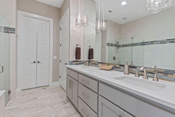 Bathroom, Dual Sink Vanities, Glass Shower, Interior, Pendant Lights, Recessed Lighting, Wood Texture Flooring
