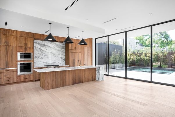 Interior, Kitchen, Marble Walls, Pendant Lights, Recessed Lighting, Stainless Steel Appliances, Wood Texture Flooring