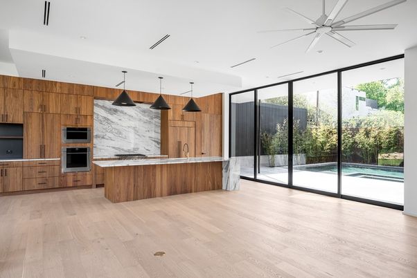 Interior, Kitchen, Marble Walls, Pendant Lights, Recessed Lighting, Stainless Steel Appliances, Wood Texture Flooring