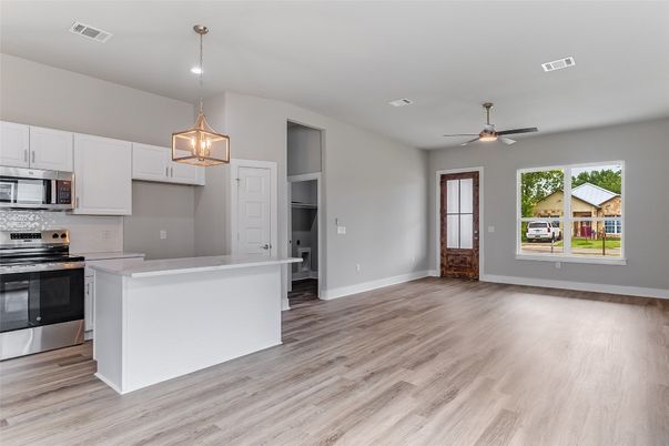 Empty room, Interior, Kitchen, Pendant Lights, Stainless Steel Appliances, Wood Texture Flooring