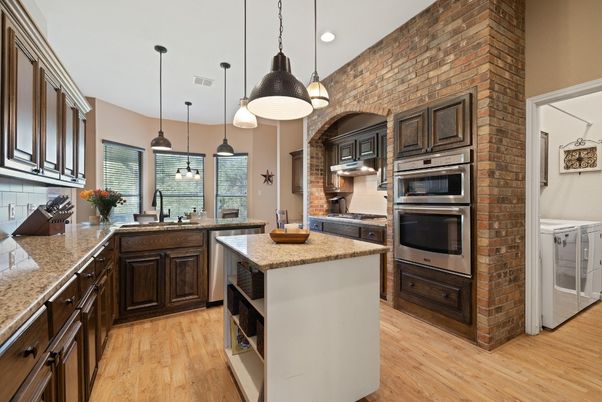 Interior, Kitchen, Pendant Lights, Recessed Lighting, Stainless Steel Appliances, Stone Walls, Wood Texture Flooring