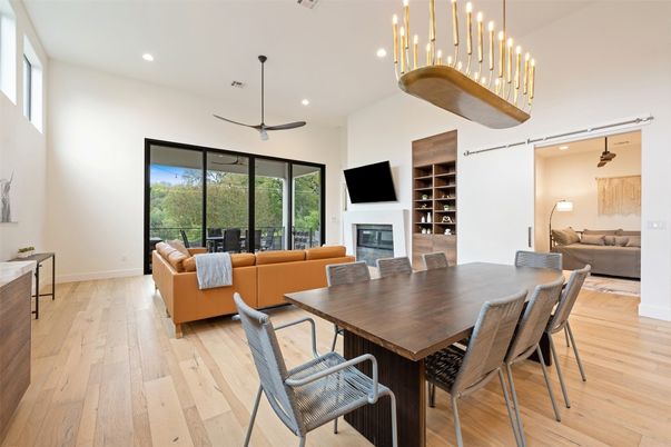 Dining room, Fireplace, Interior, Living room, Pendant Lights, Recessed Lighting, Wood Texture Flooring