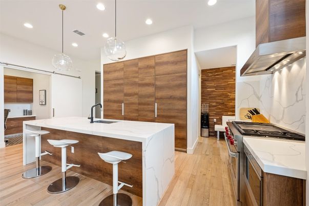 Interior, Kitchen, Marble Walls, Pendant Lights, Recessed Lighting, Stainless Steel Appliances, Wood Texture Flooring