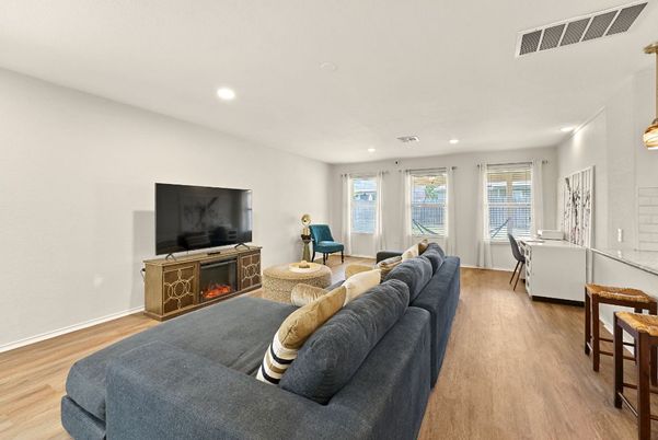 Dining room, Fireplace, Interior, Living room, Recessed Lighting, Wood Texture Flooring
