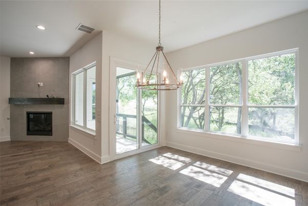 Empty room, Fireplace, Interior, Pendant Lights, Recessed Lighting, Wood Texture Flooring