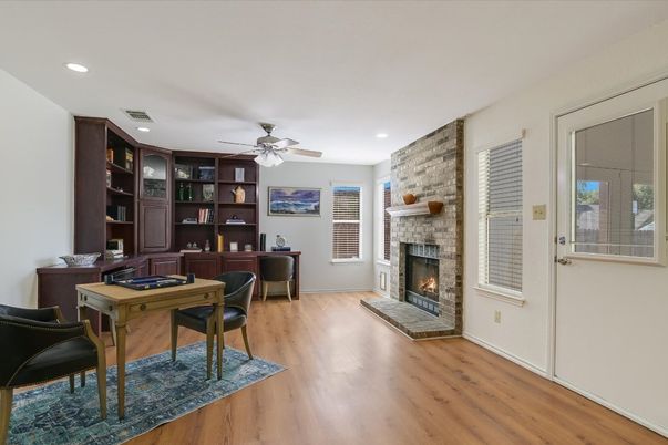 Dining room, Fireplace, Interior, Recessed Lighting, Stone Walls, Wood Texture Flooring