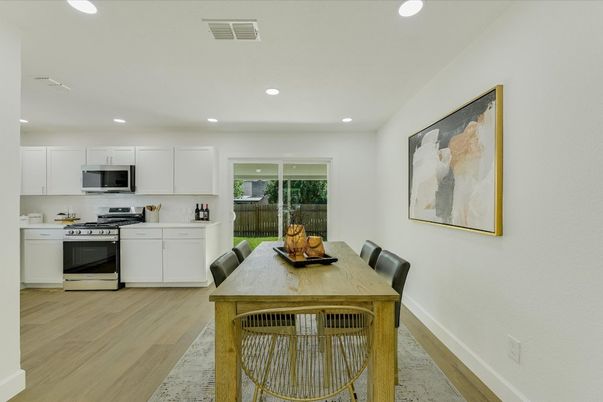 Dining room, Interior, Kitchen, Recessed Lighting, Stainless Steel Appliances, Wood Texture Flooring