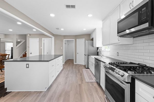 Interior, Kitchen, Recessed Lighting, Stainless Steel Appliances, Wood Texture Flooring